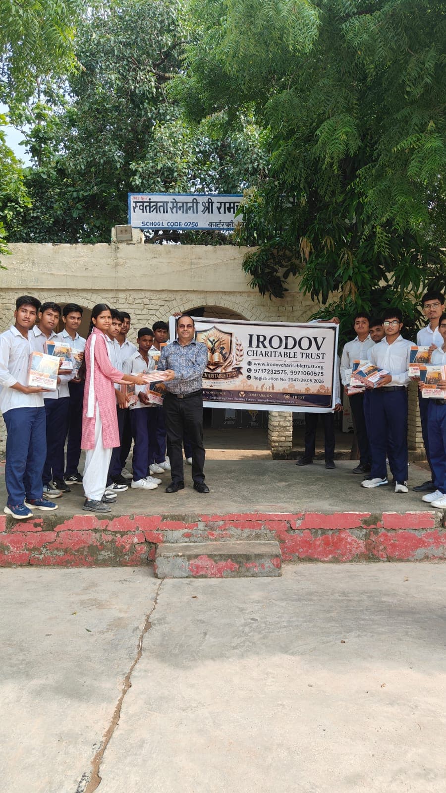 Book distribution to boys group at Carterpuri School