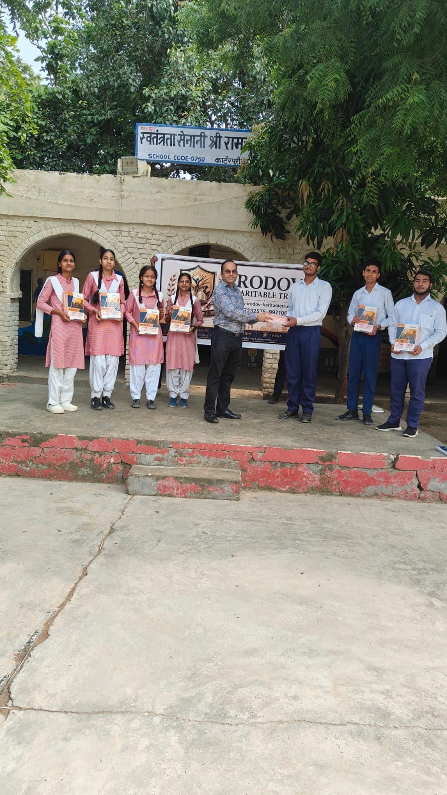Book distribution to girls and boys at Carterpuri School