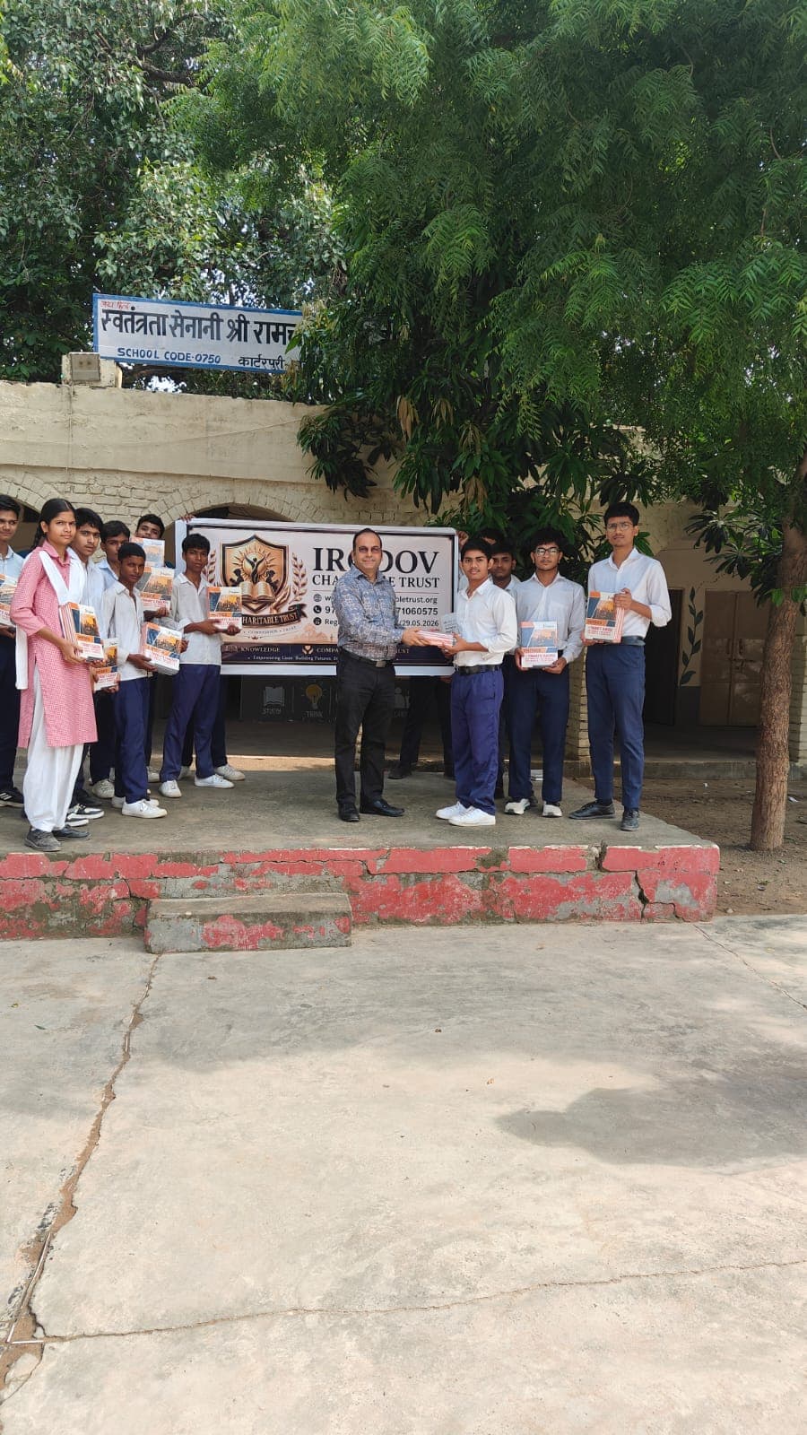 Large group photo at book distribution event