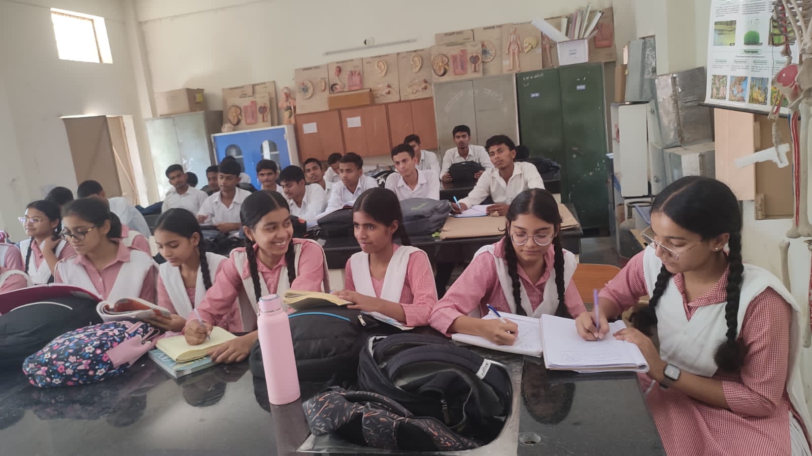 Students and teacher engaged in classroom learning