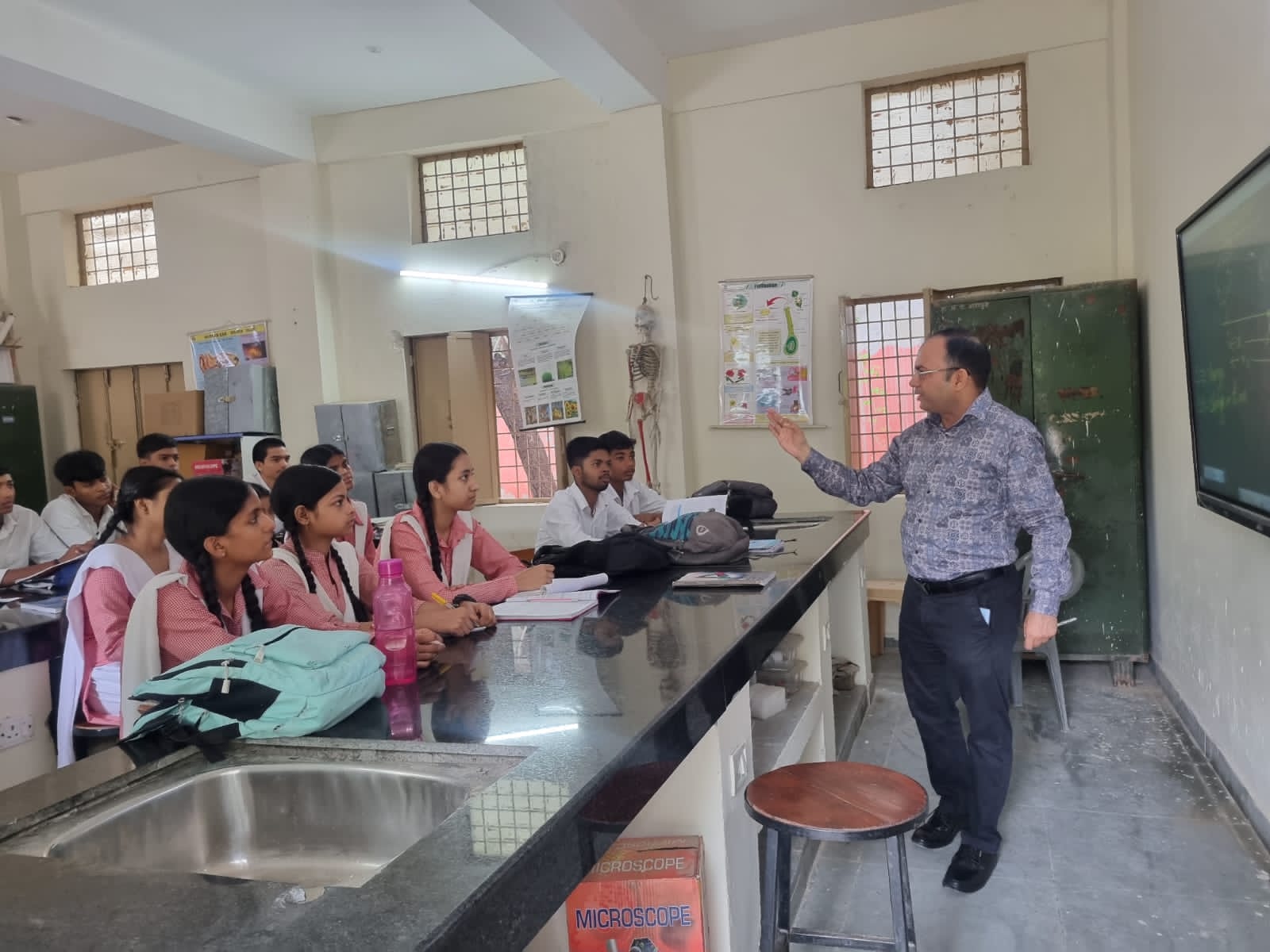 Students and teacher engaged in classroom learning
