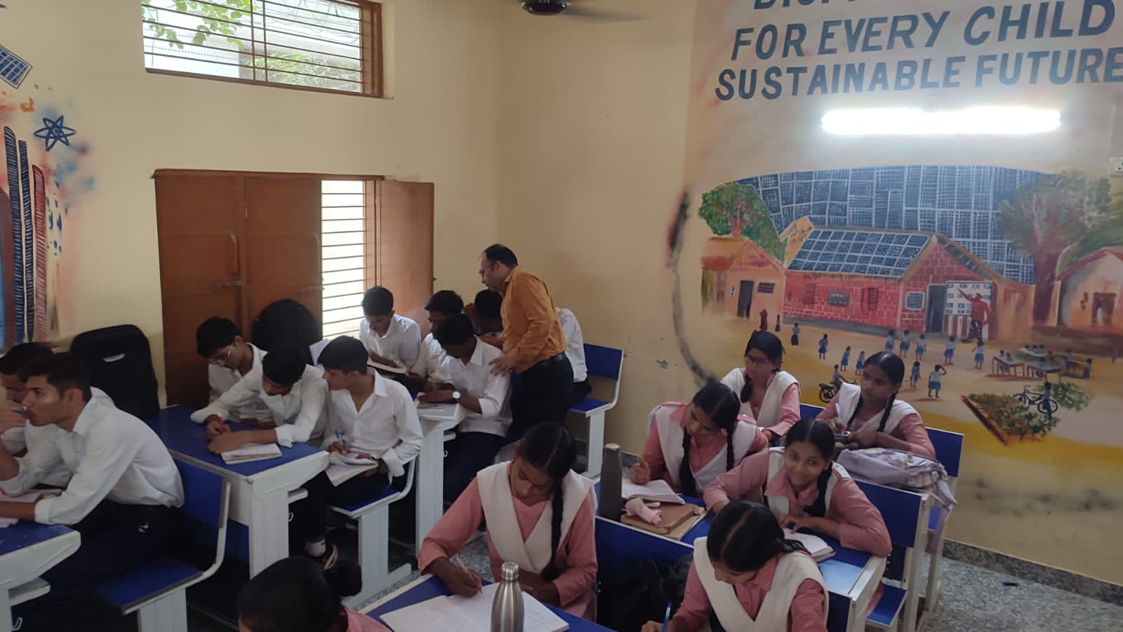 Students and teacher engaged in classroom learning
