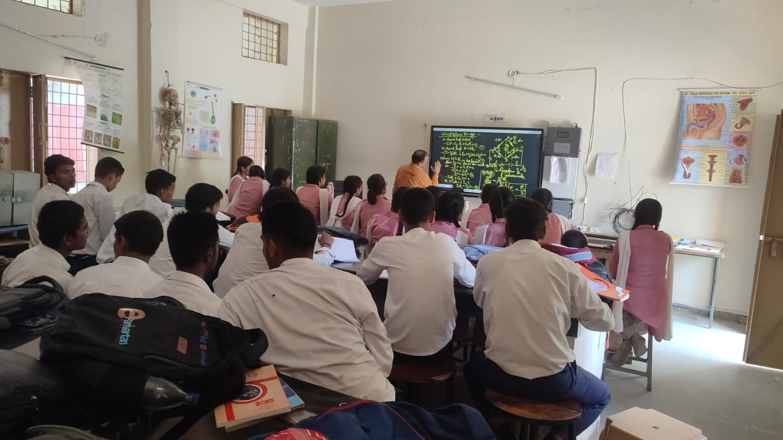 Students and teacher engaged in classroom learning