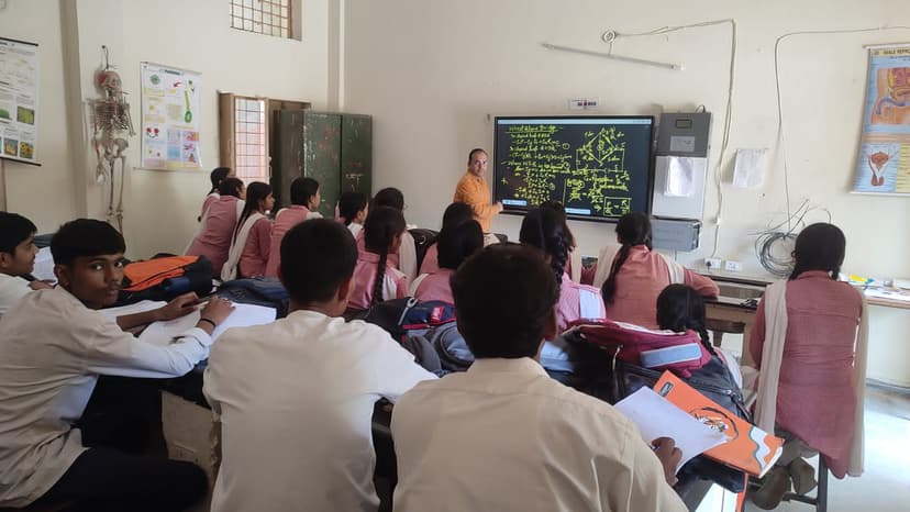 Students and teacher engaged in classroom learning